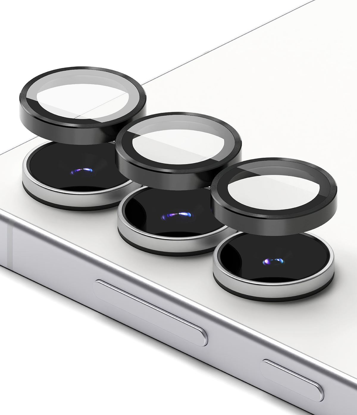 Galaxy S25 FE | Camera Lens Frame Glass - Galaxy S25 FE | Three black protective glass lens covers hovering above the camera lenses on a white smartphone back.
