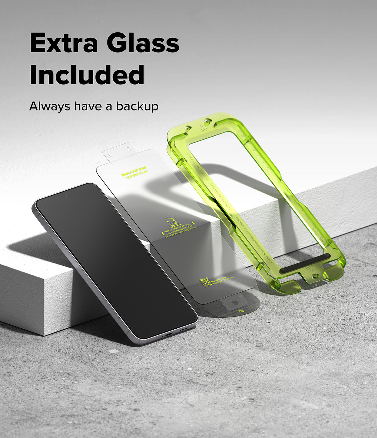 Galaxy S25 FE Screen Protector | Easy Slide Tempered Glass (2P) - Galaxy S25 FE Screen Protector - Smartphone, tempered glass sheet, and green plastic installation frame on a surface.