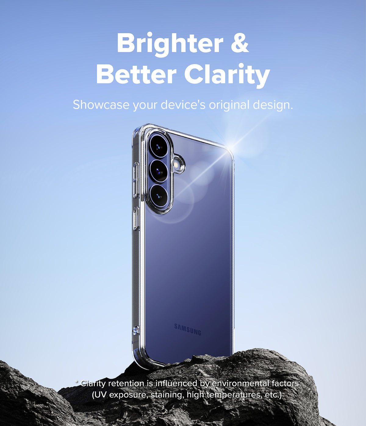 Galaxy S26 FE Case | Fusion - A clear protective phone case shown on a Samsung smartphone, standing on dark rocks against a blue sky background. White text at the top reads 'Brighter & Better Clarity' and says to showcase the device's original design.