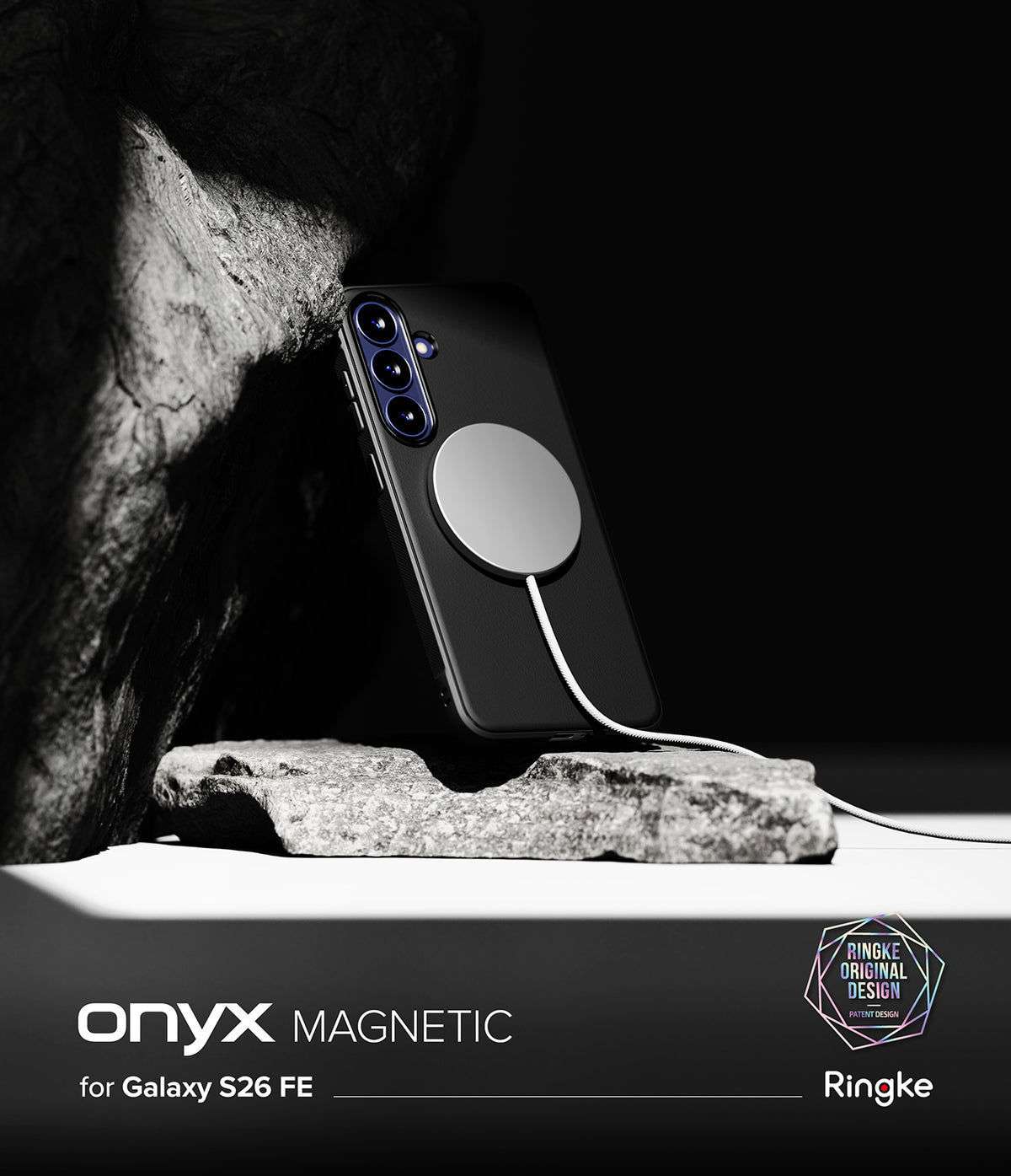Galaxy S26 FE Case | Onyx Magnetic - A black phone case with a large circular magnetic ring, shown attached to a smartphone and resting on a rock against a dark background. Text at the bottom reads 'onyx MAGNETIC for Galaxy S26 FE' with Ringke branding.