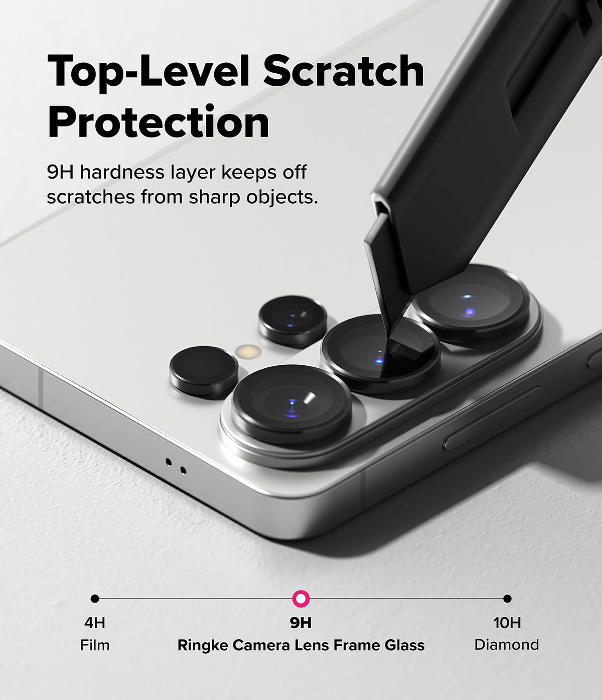 Galaxy S26 Ultra | Camera Lens Frame Glass - Galaxy S26 Ultra - A utility knife blade presses against a phone camera lens protector, demonstrating 9H scratch resistance.