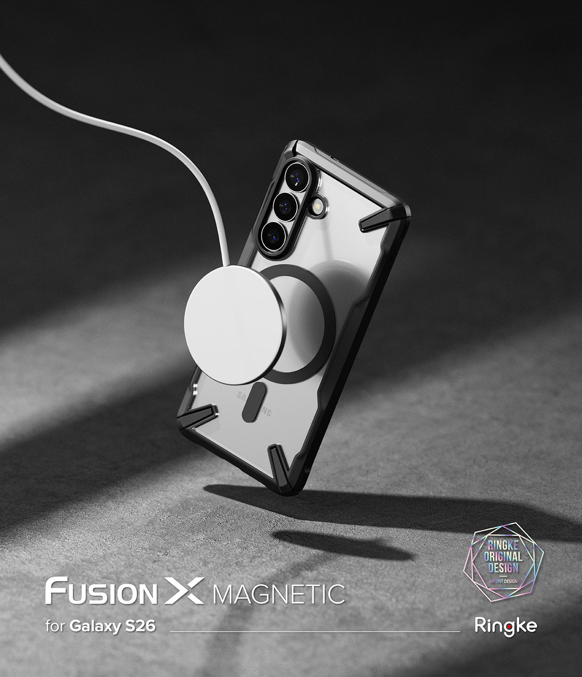 Galaxy S26 Case | Fusion-X Magnetic - Clear phone case with black frame attached to a white magnetic wireless charger.
