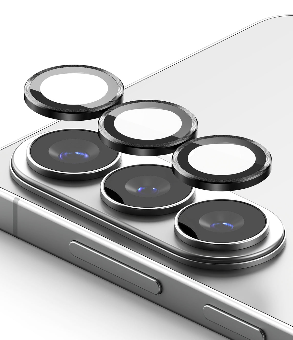 Galaxy S26 Plus / S26 | Camera Lens Frame Glass - Galaxy S26 Plus / S26 - Three black circular camera lens protectors hovering above the smartphone's rear camera array.