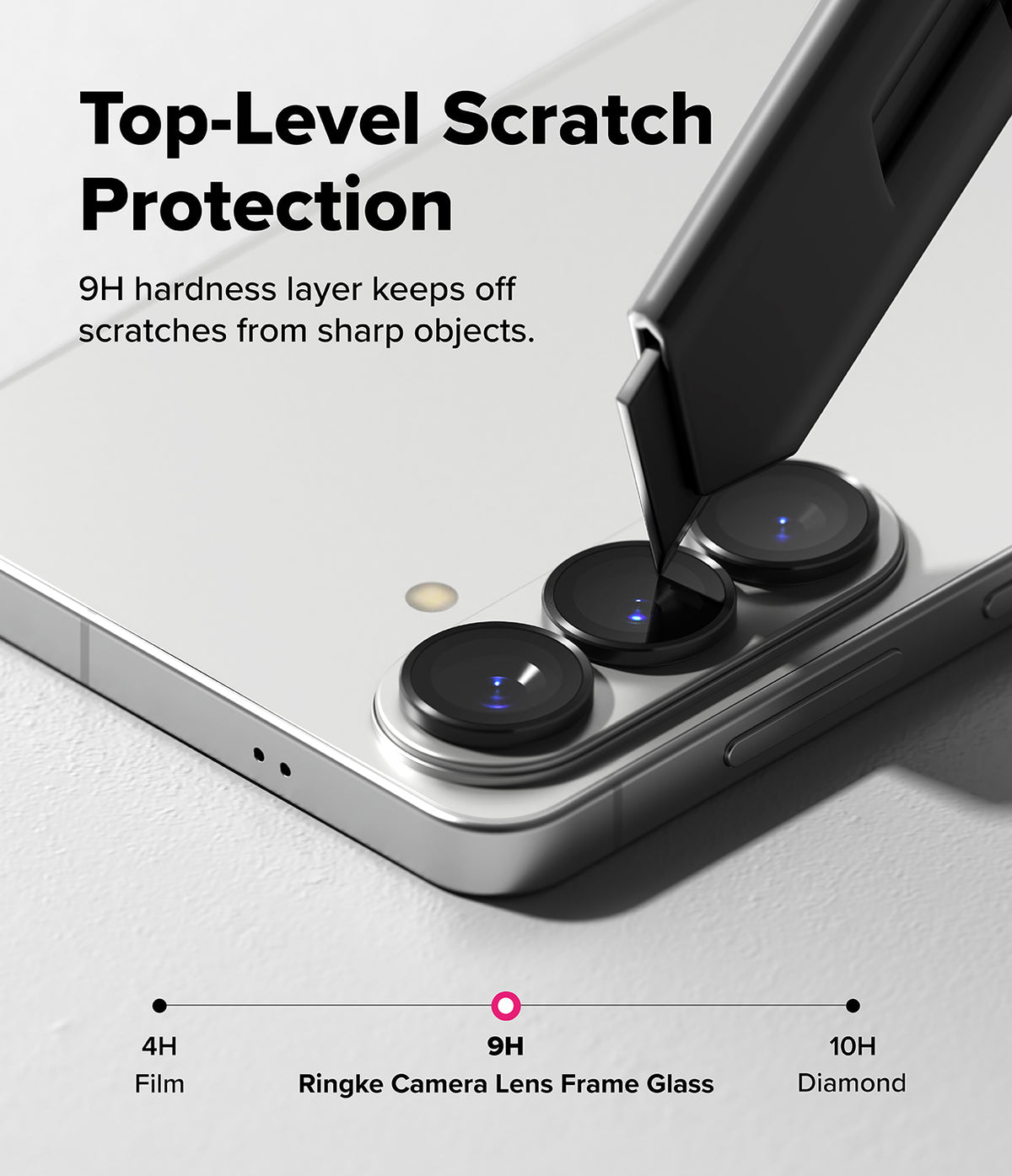 Galaxy S26 Plus / S26 | Camera Lens Frame Glass - A utility knife blade scrapes against a 9H hardness camera lens protector.