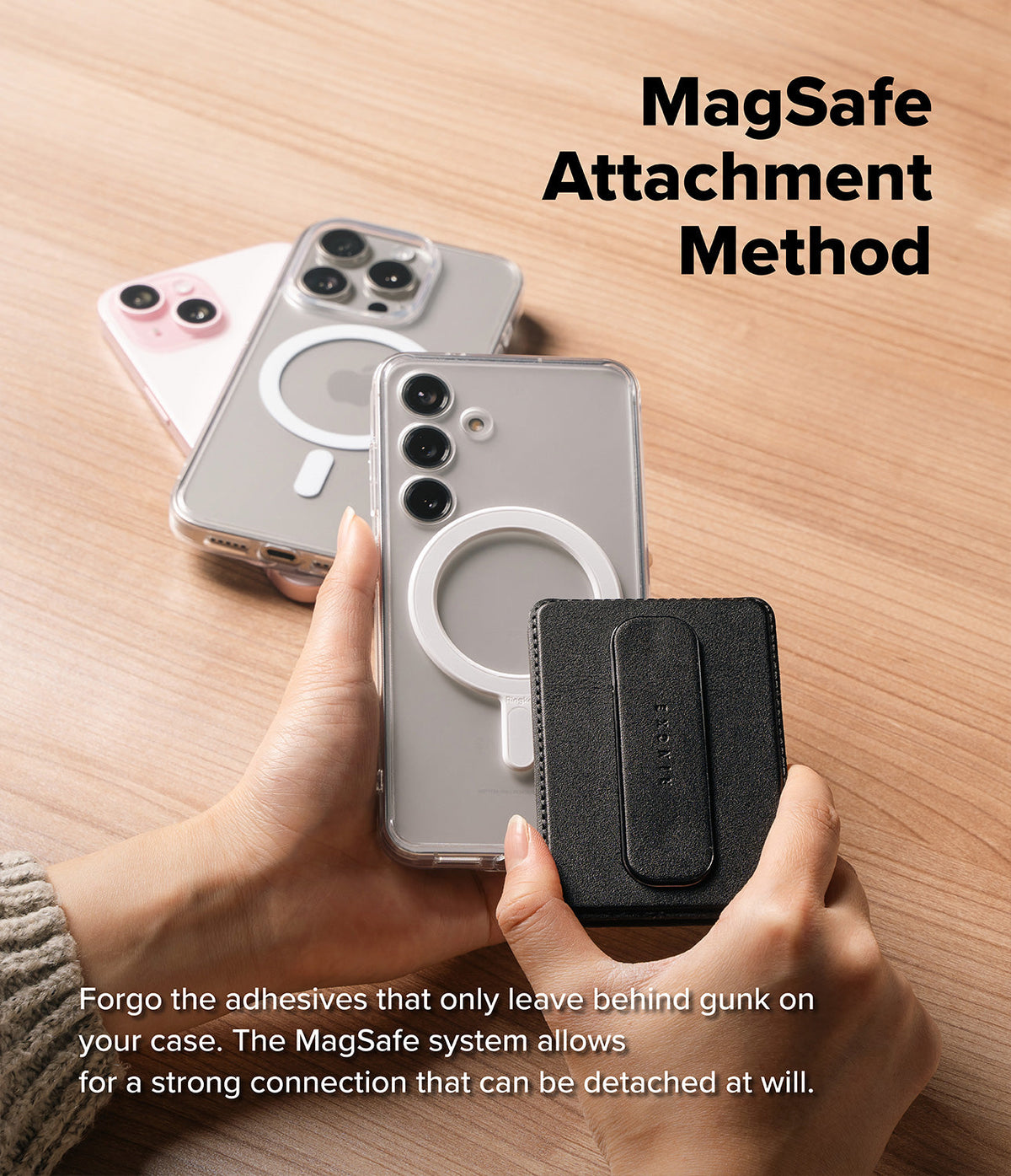 Card Holder | Slide Grip Wallet Magnetic - Hands attaching a black magnetic wallet to a clear phone case on a desk.