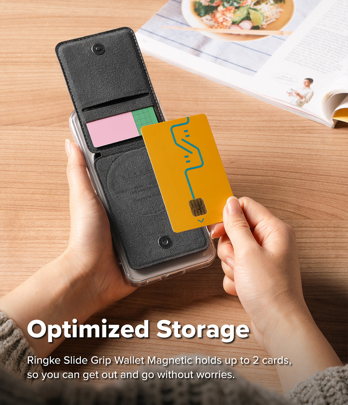 Card Holder | Slide Grip Wallet Magnetic - Hands holding a magnetic black wallet case with a yellow card being inserted.