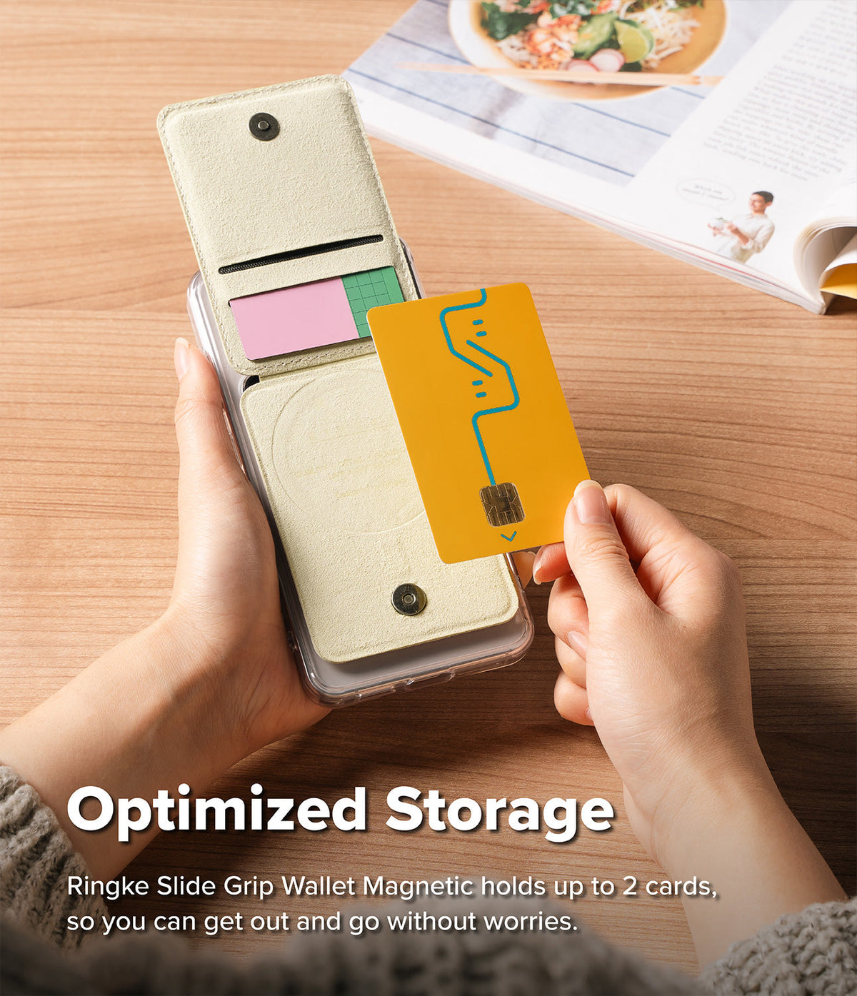 Card Holder | Slide Grip Wallet Magnetic - Hands holding a magnetic phone wallet with a yellow card being inserted.
