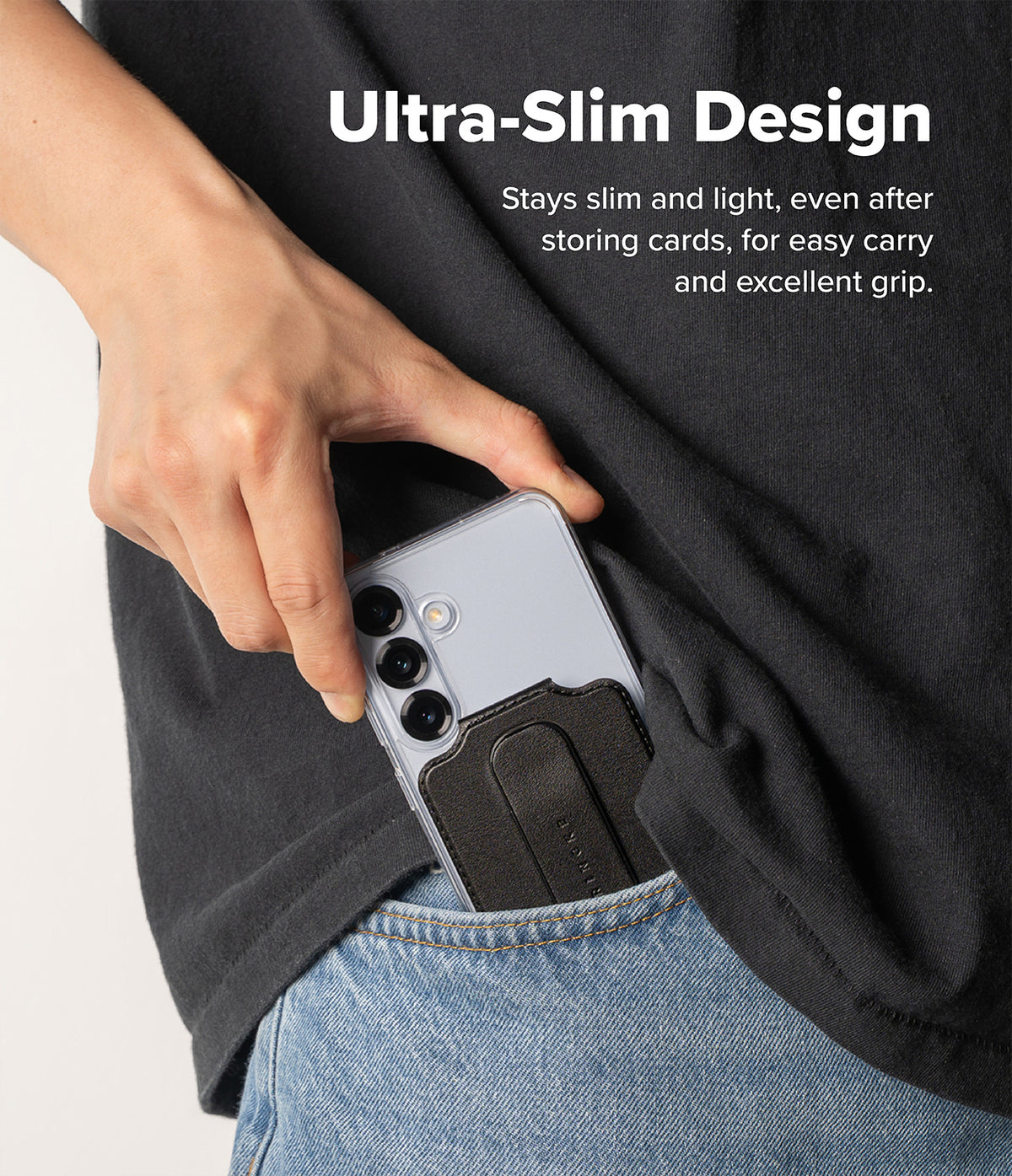 Card Holder | Slide Grip Wallet Magnetic Edge - A hand sliding a slim phone with a black card holder into a jeans pocket.