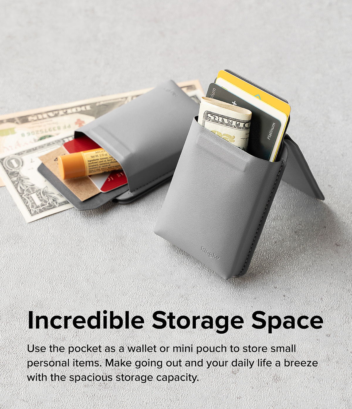 Card Holder | Stand Pocket Magnetic - Two grey magnetic card holders holding cash, credit cards, and lip balm on a grey surface.
