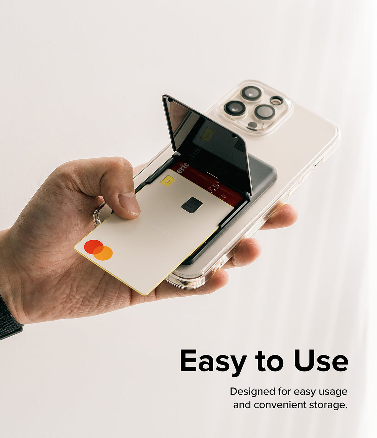 Card Holder | Stand Slot - Hand holding a phone with a black card holder stand open, revealing credit cards inside.
