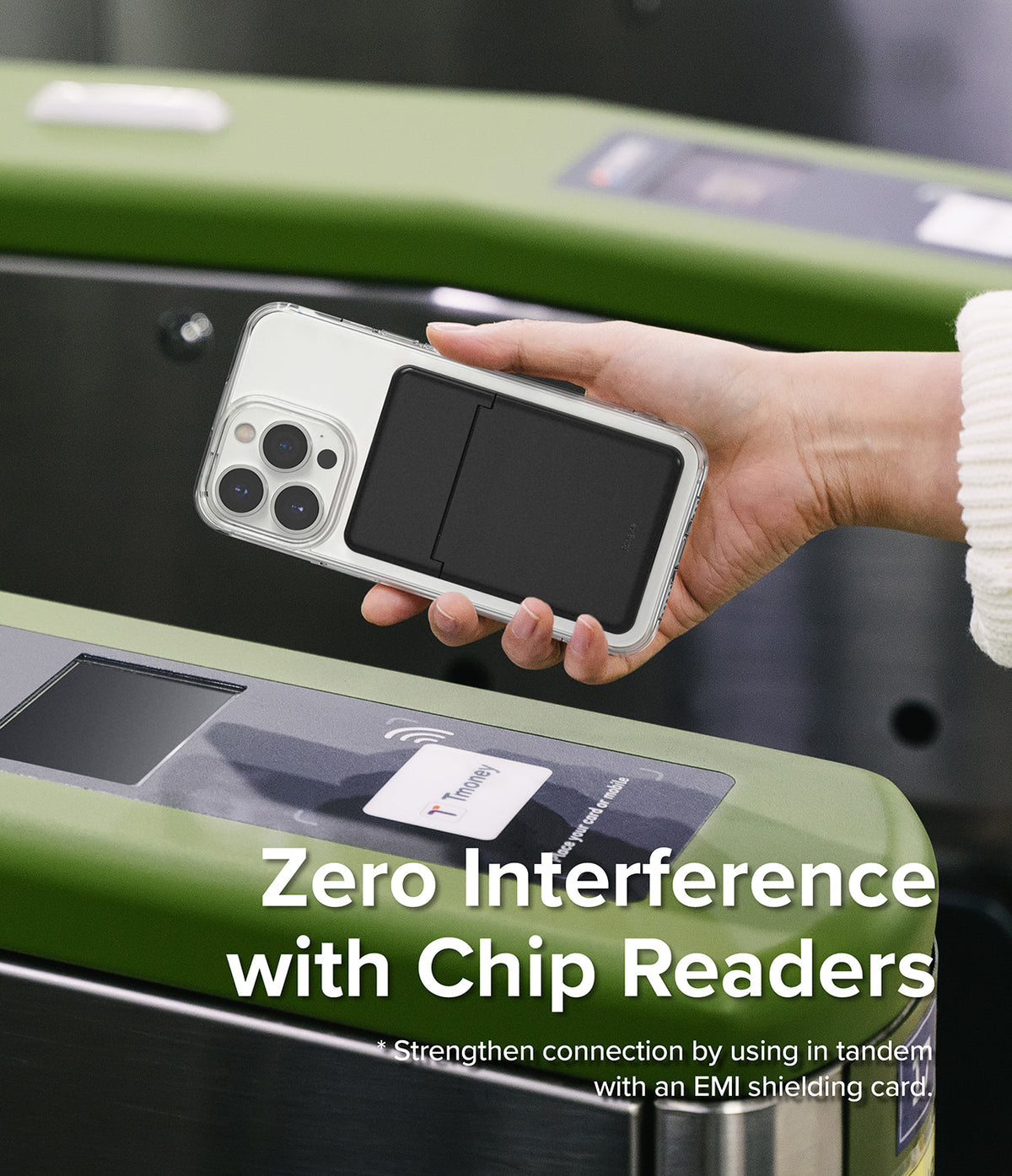 Card Holder | Stand Slot - Hand holding a phone with a black card holder case over a subway turnstile chip reader.