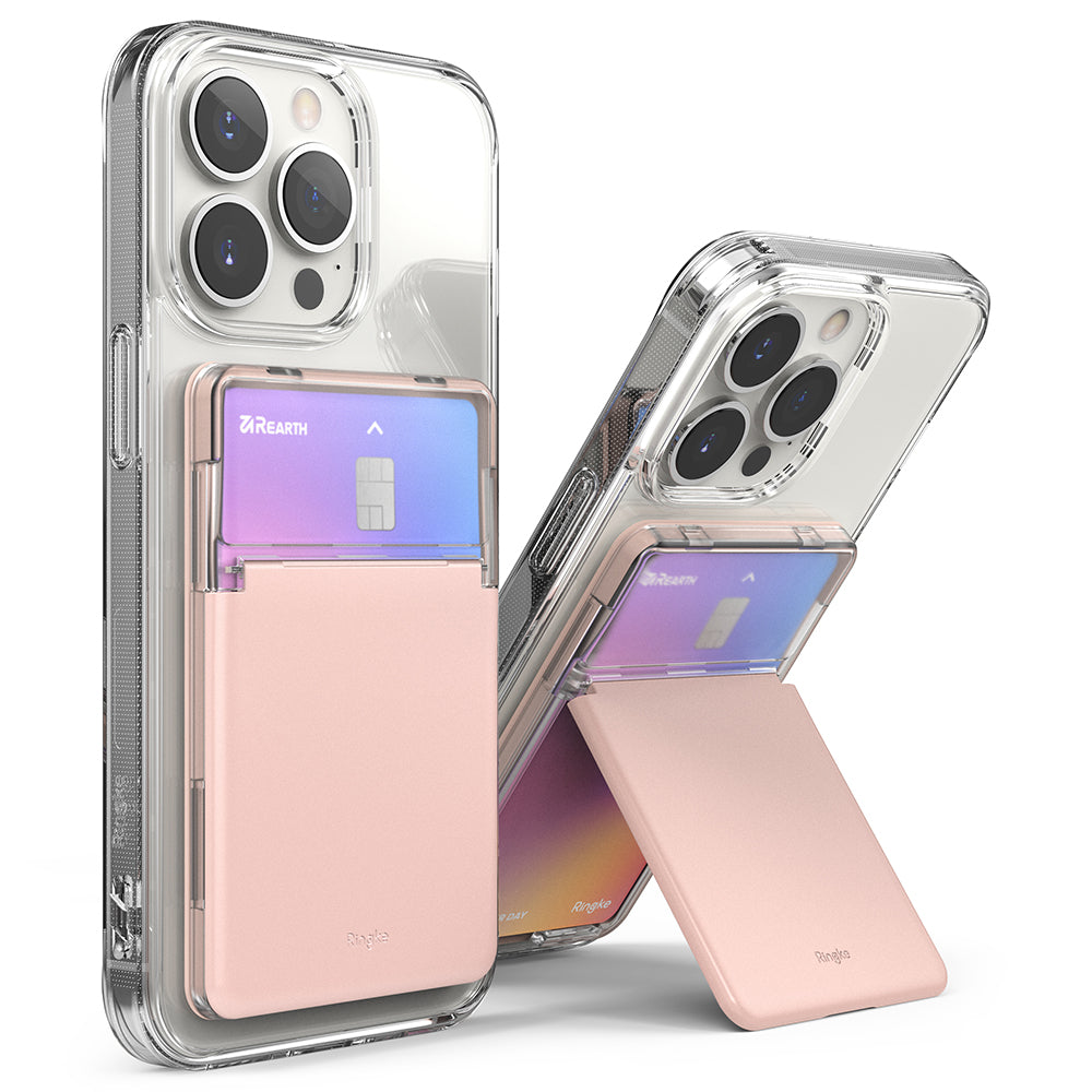 Card Holder | Stand Slot - Two clear phone cases with pink card holder attachments, one folded flat and one acting as a kickstand.