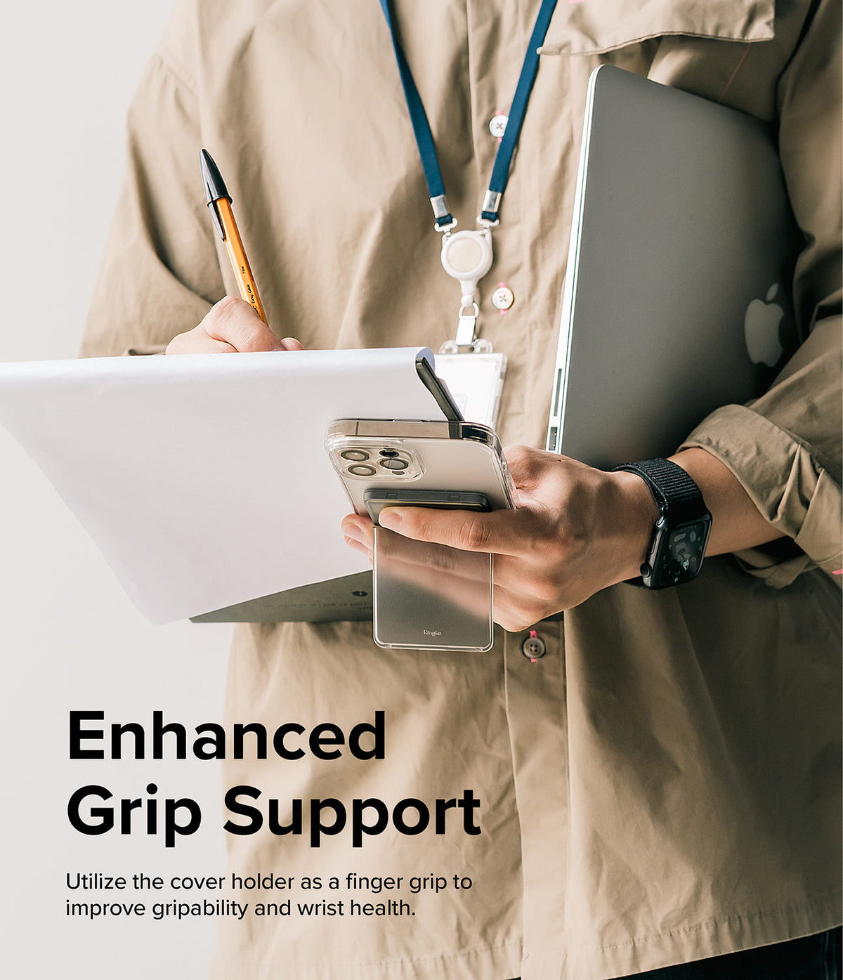 Card Holder | Stand Slot - Person holding a phone with a card holder stand attached, using it as a finger grip while holding a laptop.