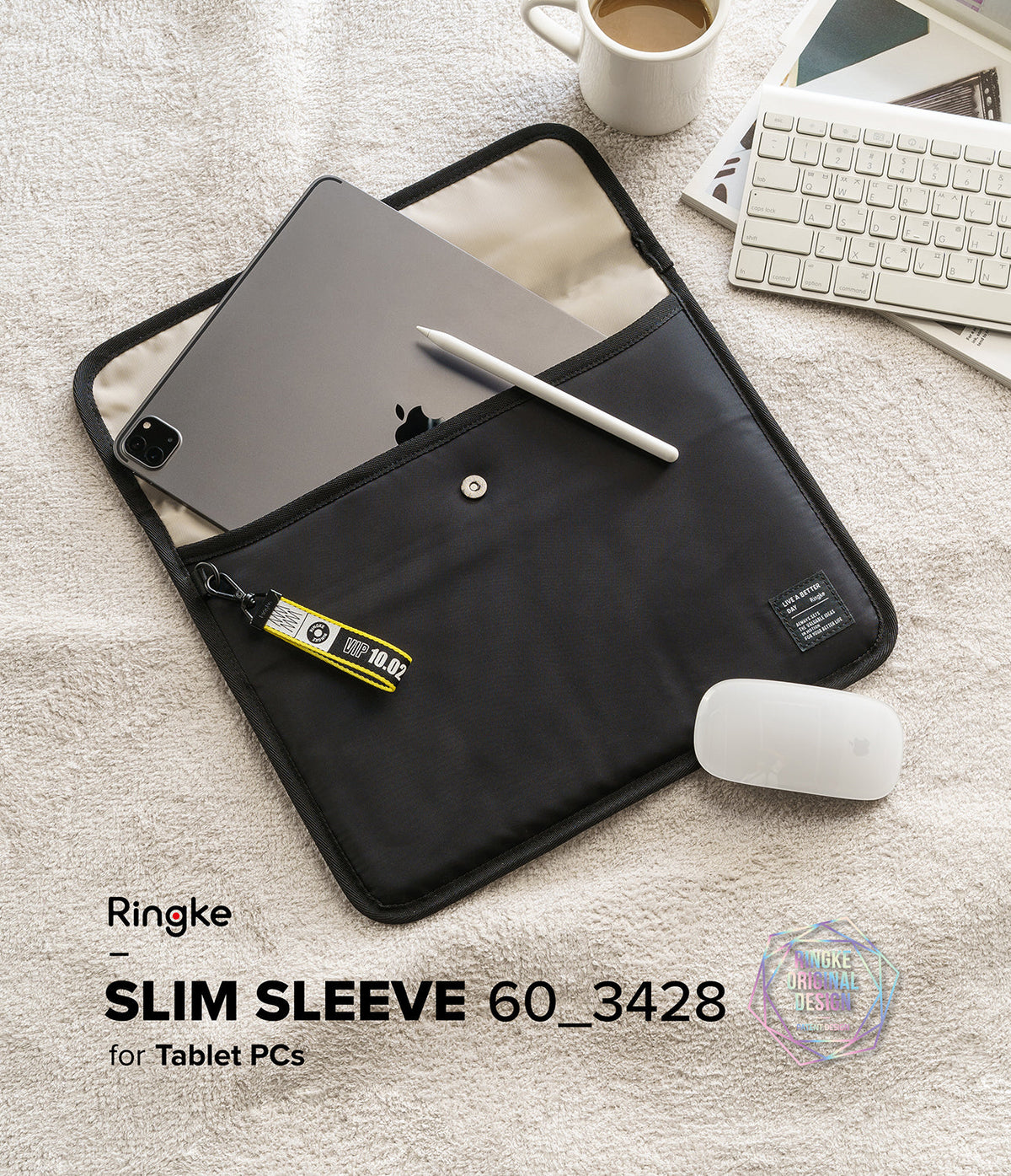 Pad Pouch | Slim Sleeve - Black tablet sleeve with a tablet, stylus, and yellow keychain tag on a textured surface.
