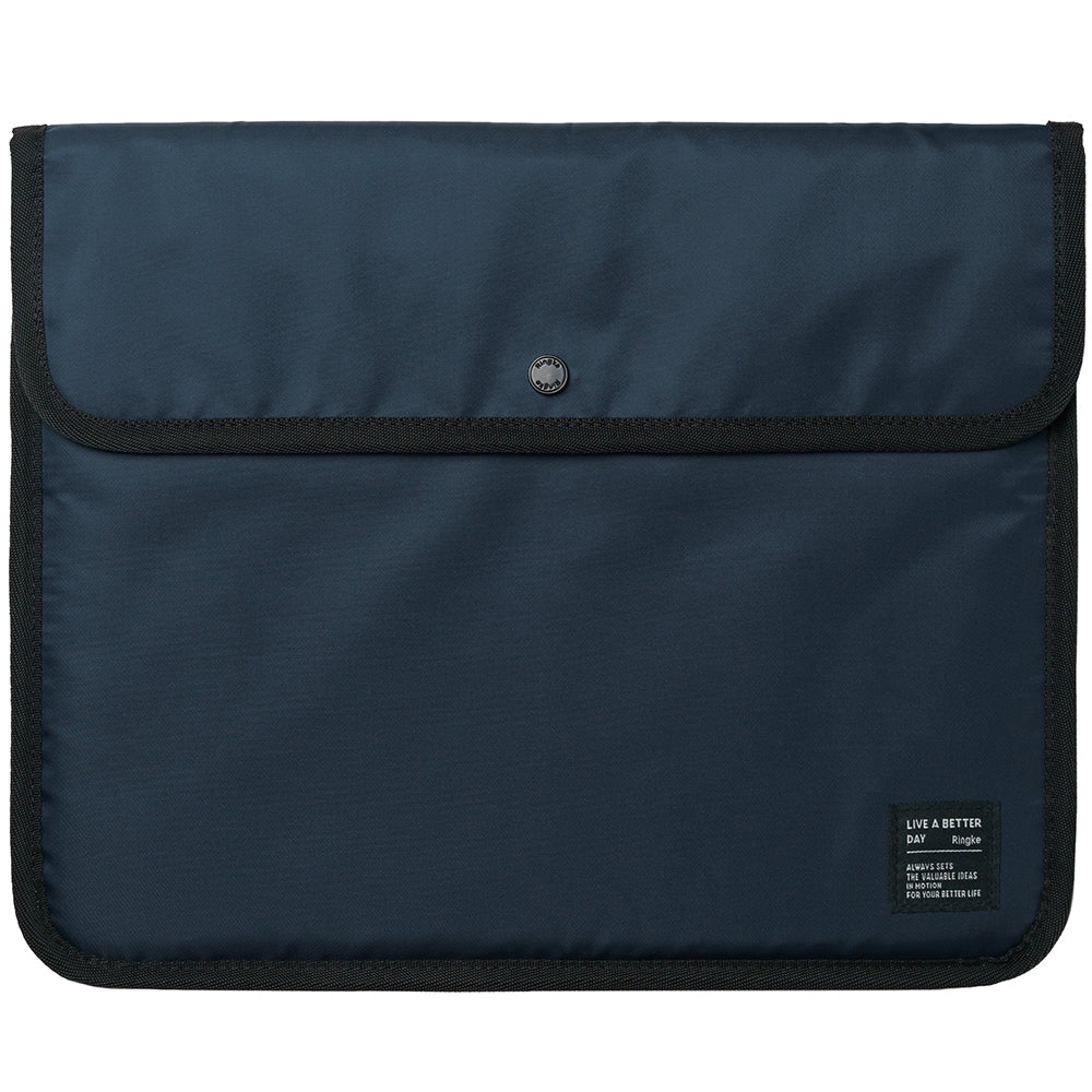 Pad Pouch | Slim Sleeve - Navy blue fabric tablet sleeve with a black snap button closure and a small branded label in the corner.