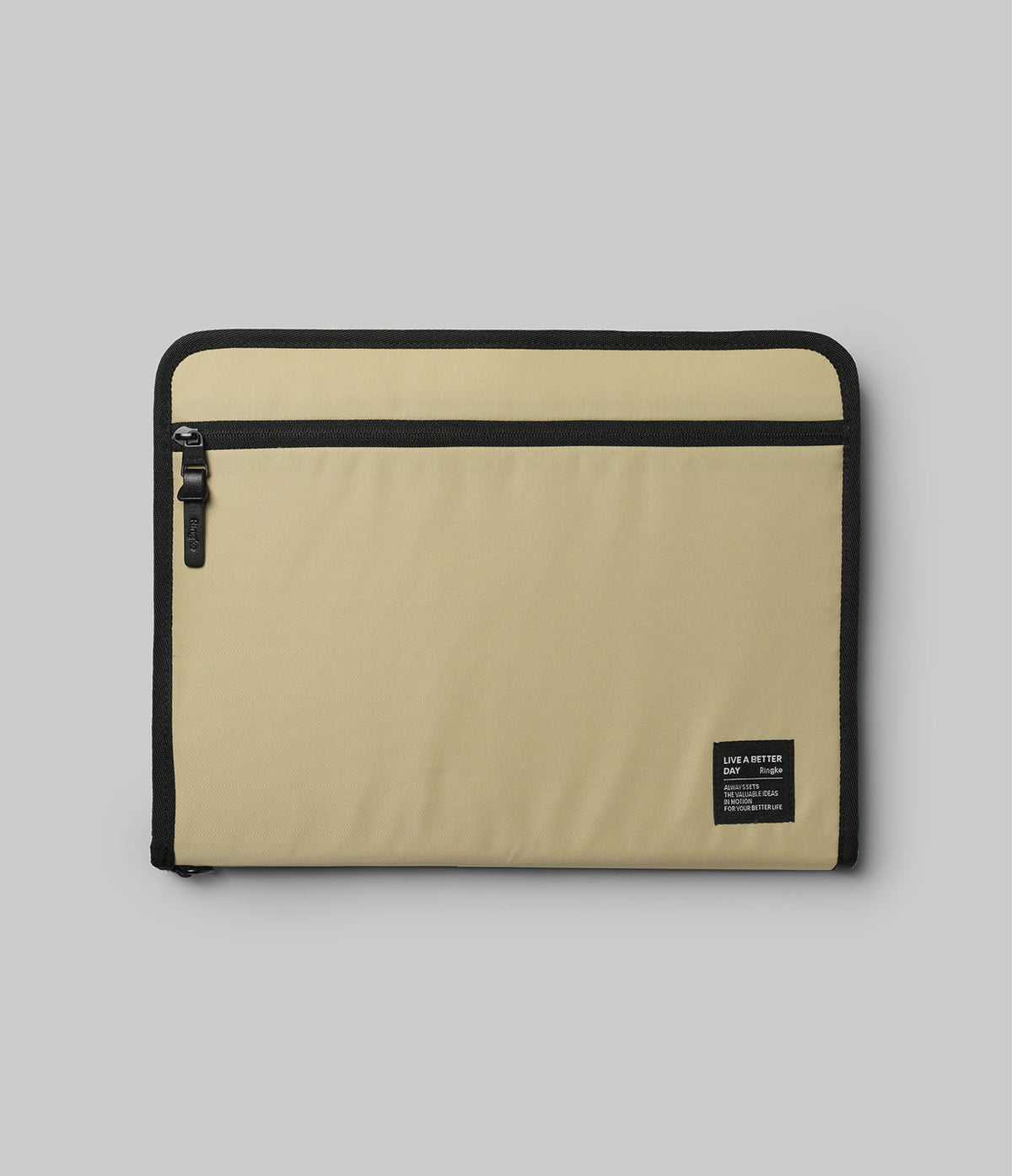 Pad Pouch | Smart Zip Pouch - Beige rectangular zippered tablet sleeve with black trim and a small branded label on the corner.