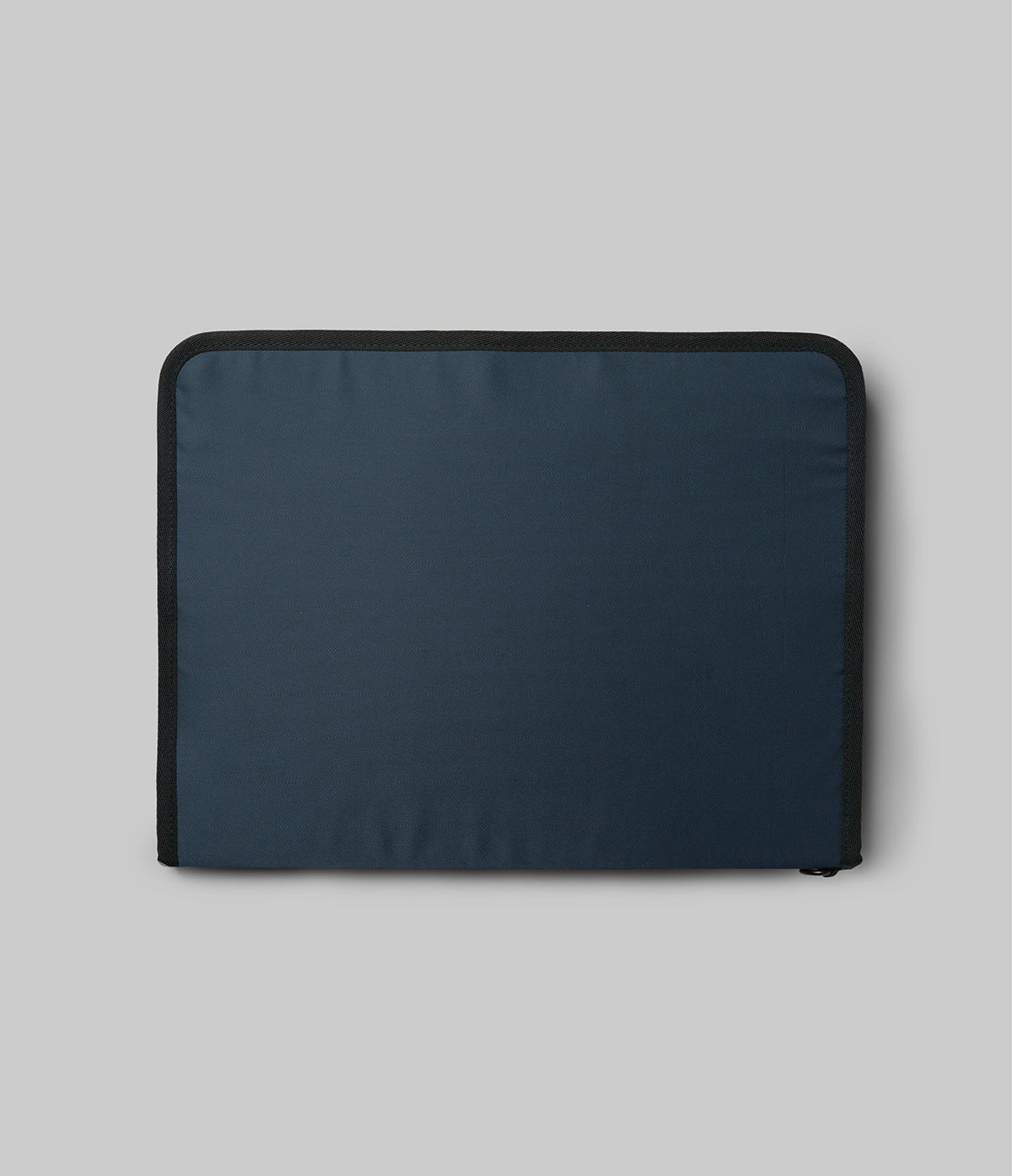 Pad Pouch | Smart Zip Pouch - A rectangular navy blue zippered pouch with black trim against a light gray background.