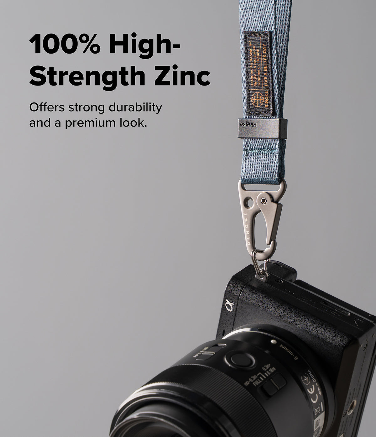 Holder Link Tactical Webbing Hand Strap - Blue webbing strap with a zinc alloy carabiner attached to a black camera.