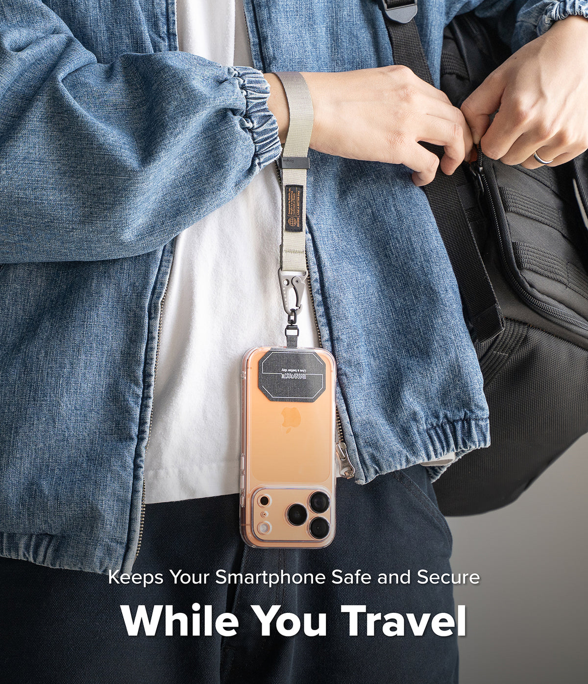 Holder Link Tactical Webbing Hand Strap - A beige tactical webbing strap attached to a smartphone, worn around the wrist.