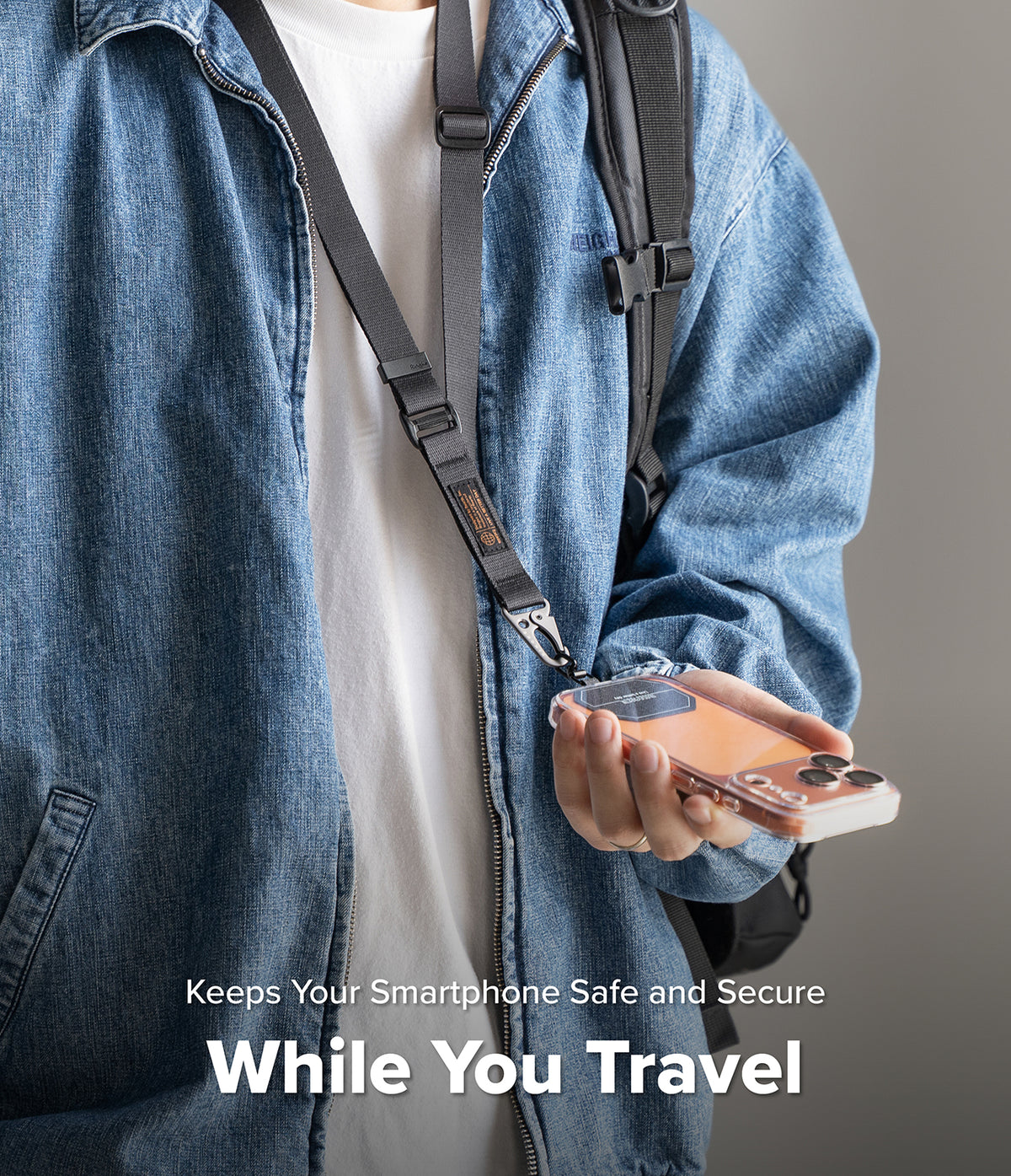 Holder Link Tactical Webbing Lanyard Strap - Person wearing a black tactical lanyard attached to a smartphone case.
