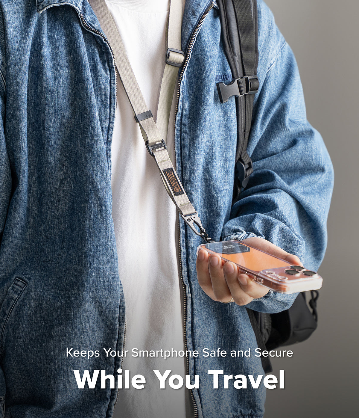Holder Link Tactical Webbing Lanyard Strap - Person wearing a beige tactical lanyard attached to a smartphone in a case.