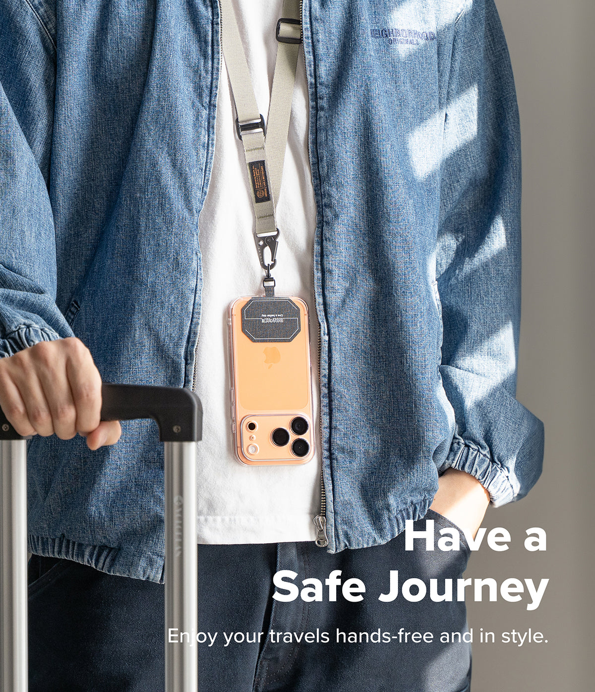 Holder Link Tactical Webbing Lanyard Strap - A person wearing a beige tactical lanyard holding a smartphone around their neck.