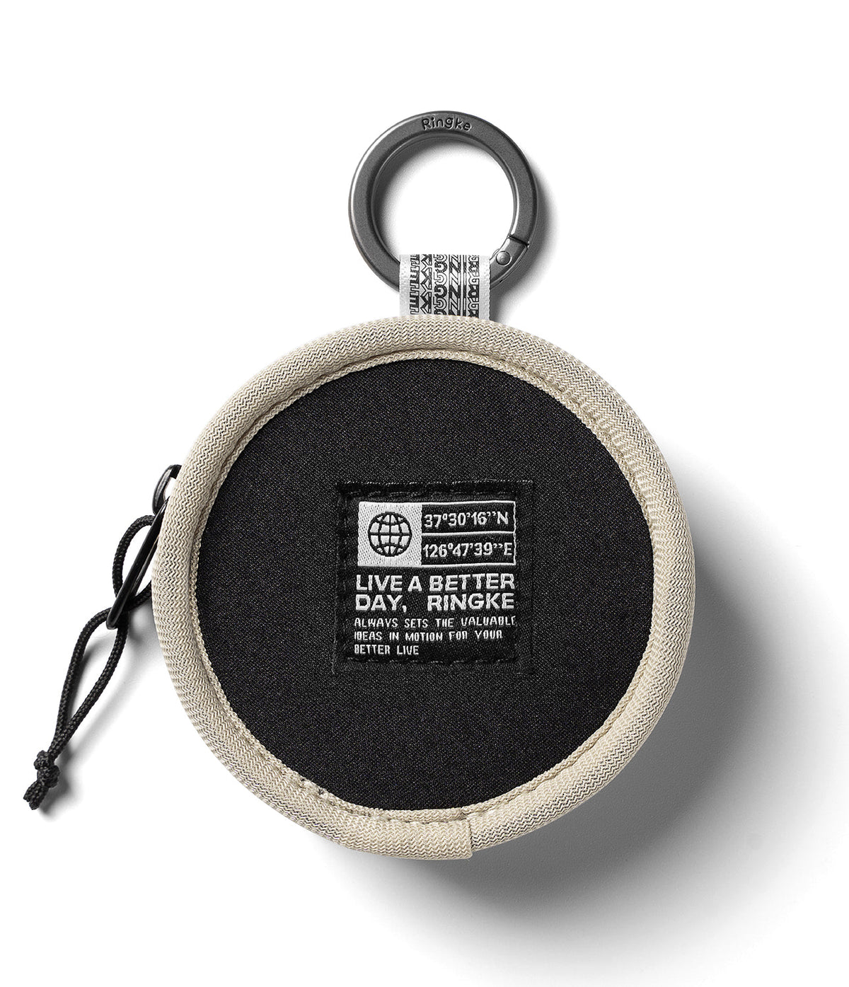 Mini Pouch | Tambourine Bag - Round black pouch with beige trim, carabiner clip, and a branded patch featuring coordinates.