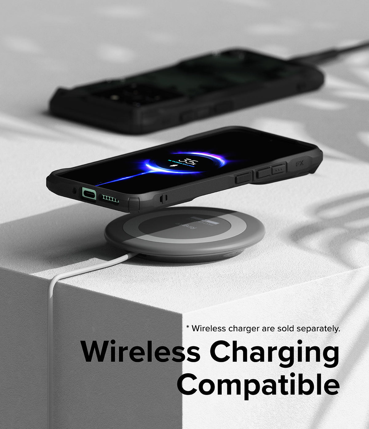 Xiaomi 14 Case | Fusion-X - A Xiaomi 14 in a black Fusion-X case wirelessly charging on a circular pad.