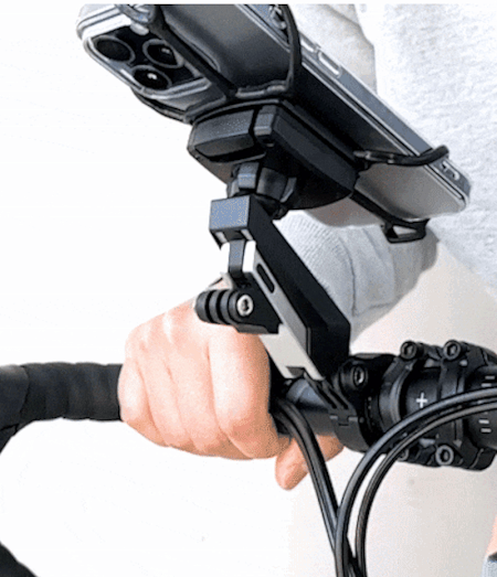 Quick & Go | Bike Mount Vibration Damper Add-on - A hand attaches a vibration damper module to a bike phone mount.