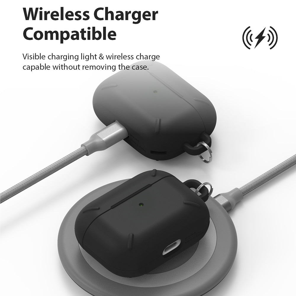 AirPods Pro Case - Black - Black AirPods Pro case being charged via cable and on a wireless charging pad.
