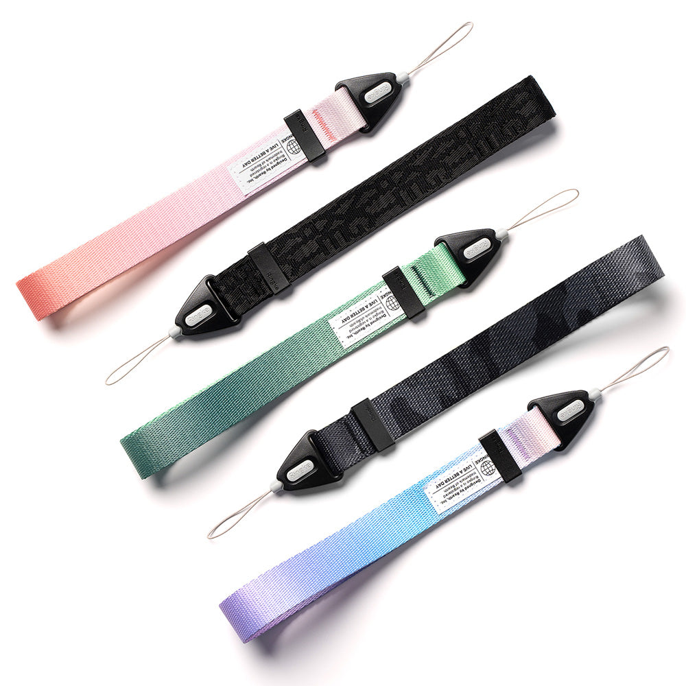 Hand Strap | Basic - Four colorful fabric wrist straps with black plastic buckles and thin attachment loops on a white background.