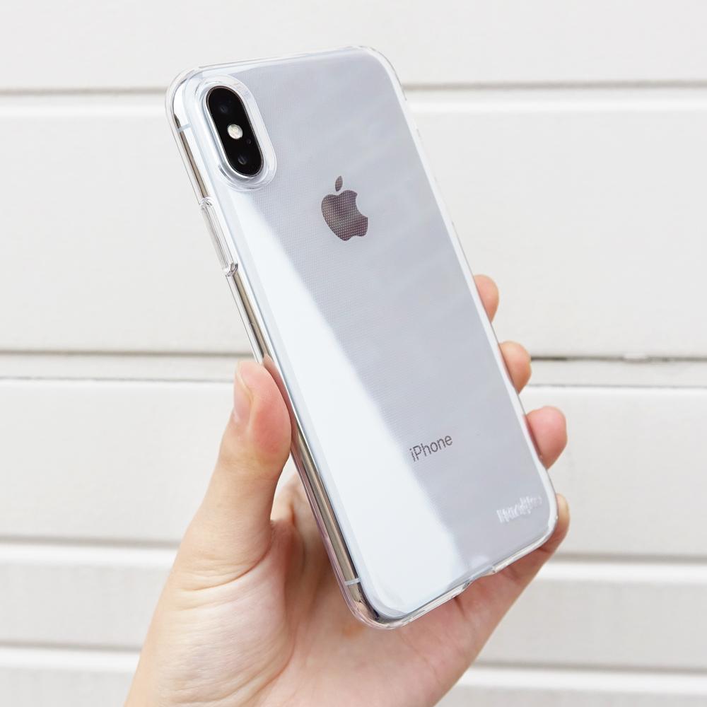 iPhone X Case | Air - A hand holding an iPhone X in a clear, slim protective case against a white slatted background.