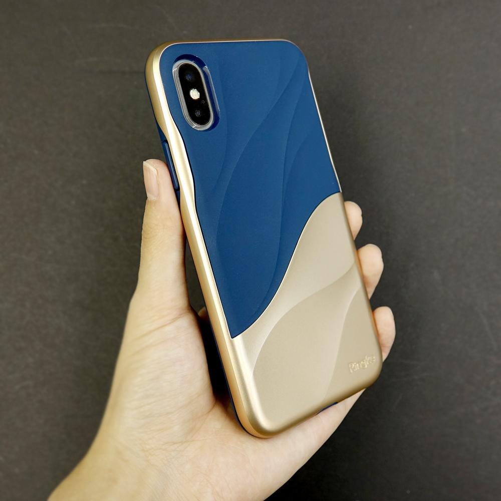 iPhone X Case | Wave - A hand holds a navy blue and gold iPhone case featuring a sleek, wavy design against a dark background.