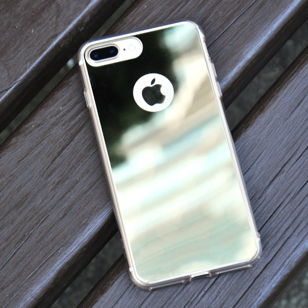 iPhone 7 Case | Mirror - Reflective silver phone case with a cutout for the Apple logo, resting on a wooden bench.