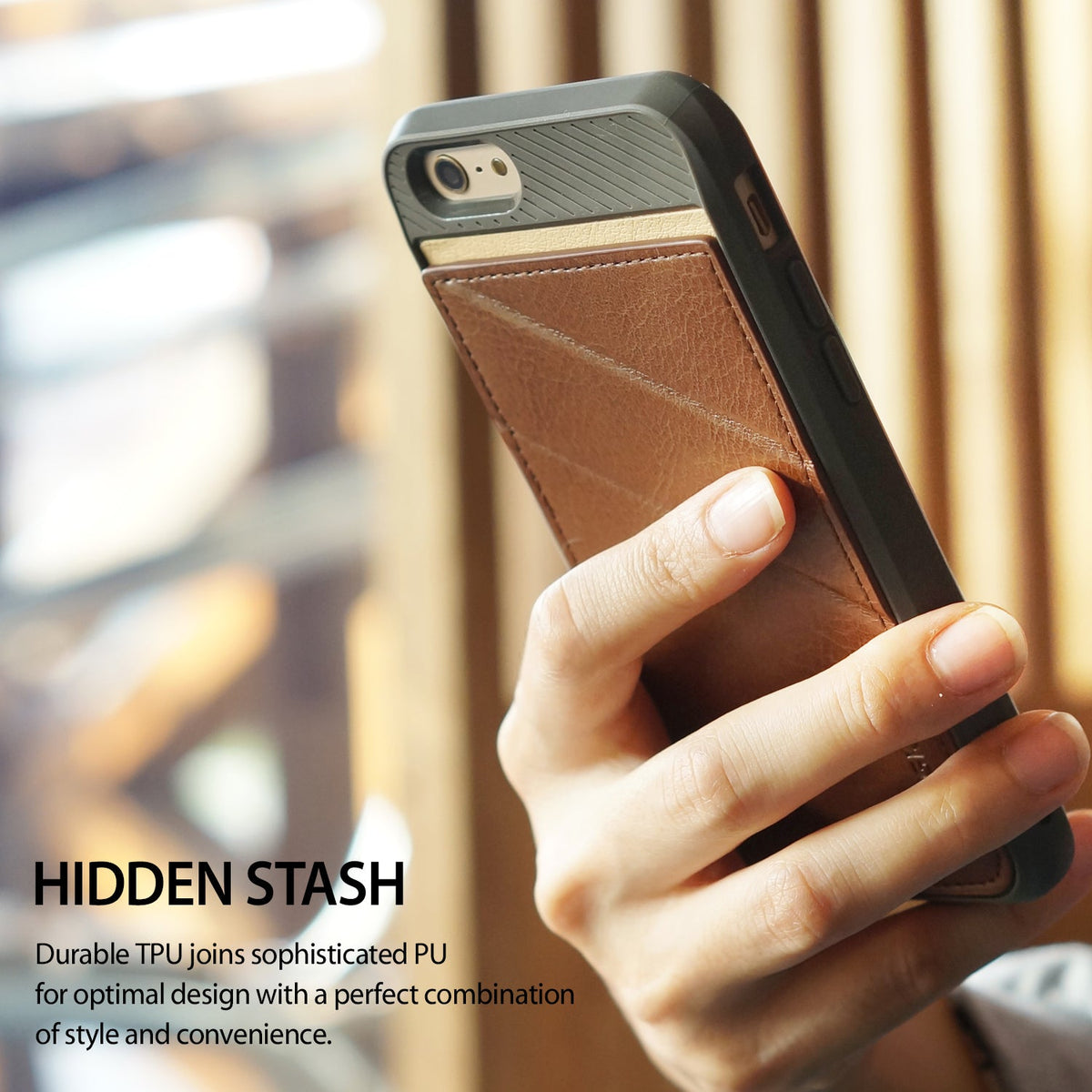 iPhone 6s / 6 Case | Edge - Hand holding a phone with a black TPU frame and a brown leather card-holder back panel.