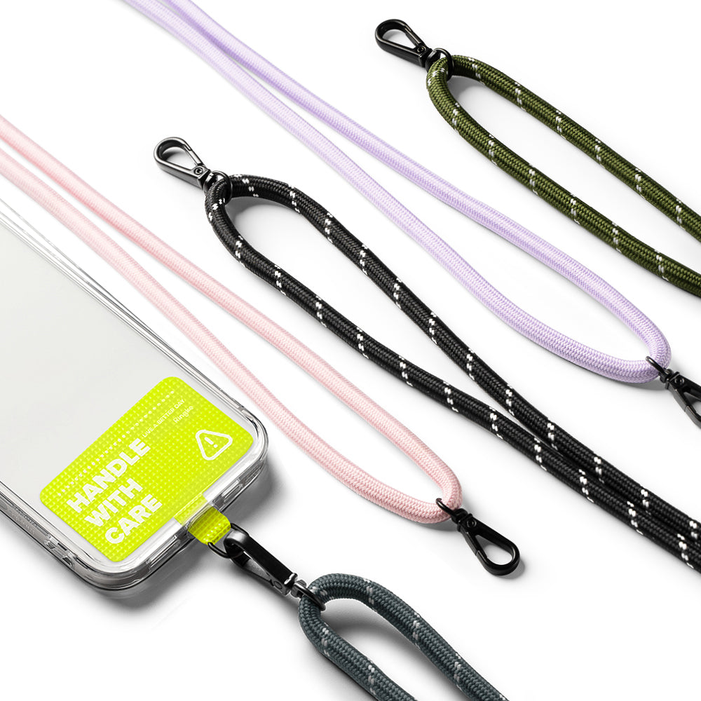 Holder Link Strap | Tarpaulin Neon Green - Neon green phone case with Handle With Care label attached to various colorful rope lanyards.