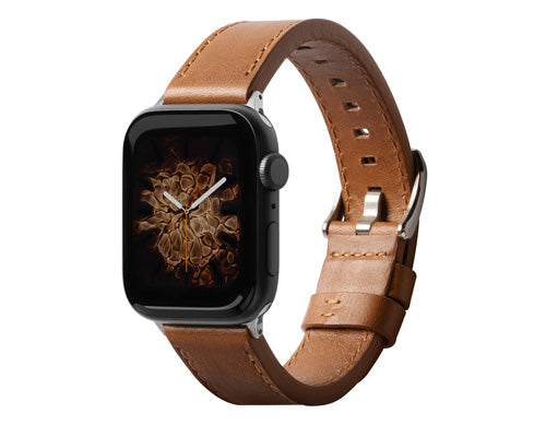 Apple Watch on brown smoke watch face with brown leather bands