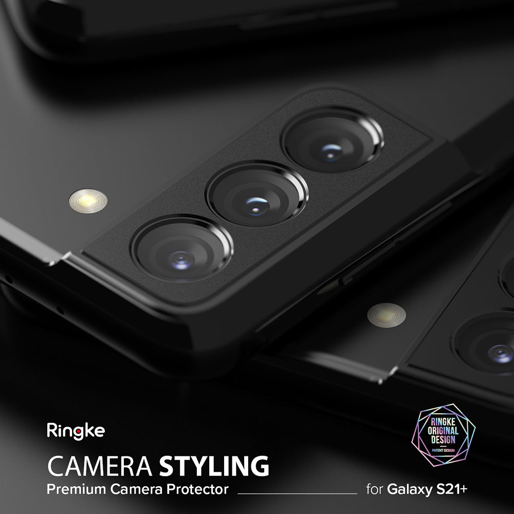 Galaxy S21 Plus | Camera Styling - Close-up of a black smartphone camera housing with a protective metal cover installed.