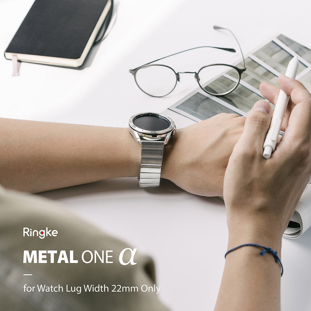 Watch Lug 22mm | Metal One Band α - Silver - Person wearing a silver metal watch band on a white desk with glasses.