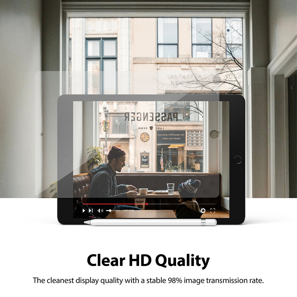 Tempered Glass | iPad - Clear screen protector overlaying an iPad displaying a video of a man and child in a cafe.