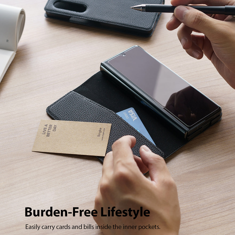 Galaxy Z Fold 3 Case | Folio Signature EZ Strap - Black leather folio case holding a folded phone, card, and ID.