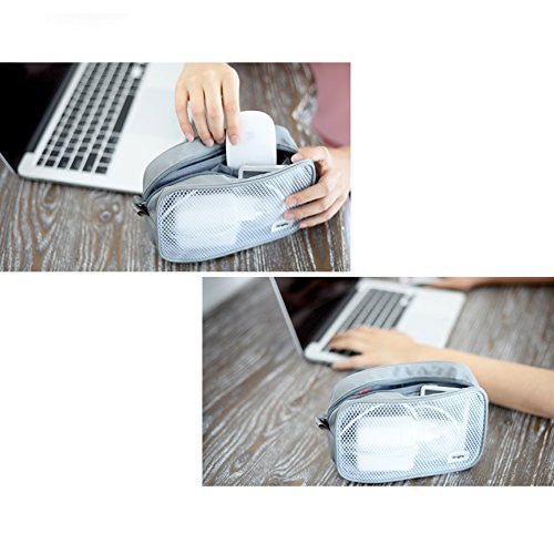 Travel Organizer Pouch - Hands placing tech accessories into a gray mesh zippered travel organizer on a wooden desk.
