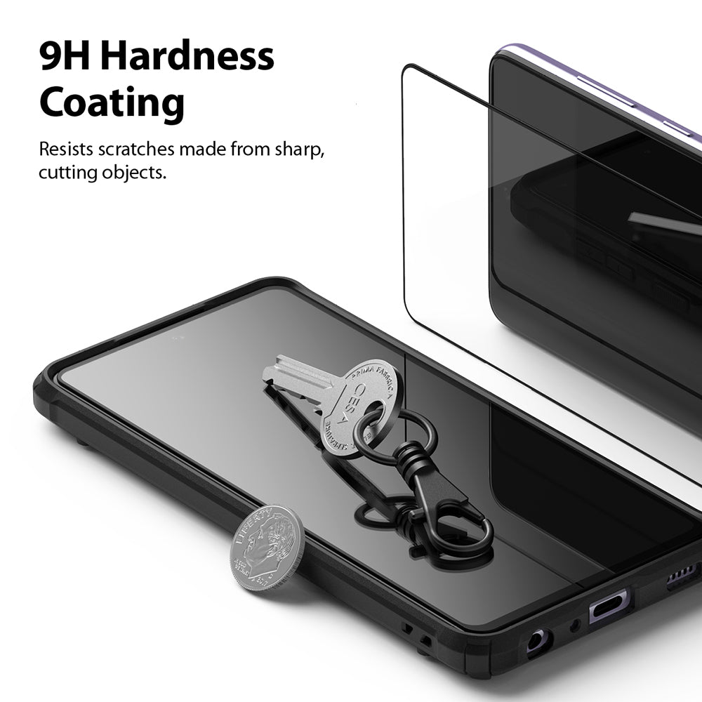 Galaxy A72 Screen Protector | Invisible Defender - A smartphone with a glass screen protector, a key, and a coin.