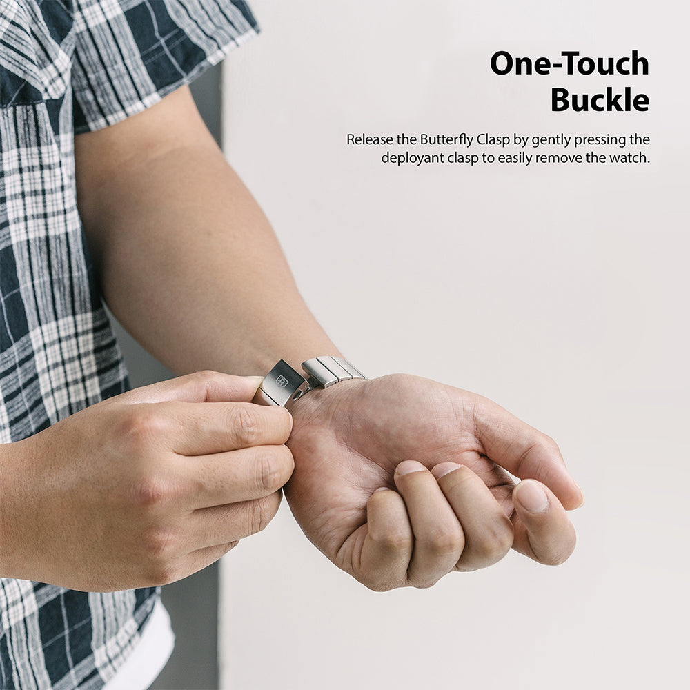Watch Lug 22mm | Metal One Band α - Silver - Person releasing a silver metal watch band using a butterfly clasp.