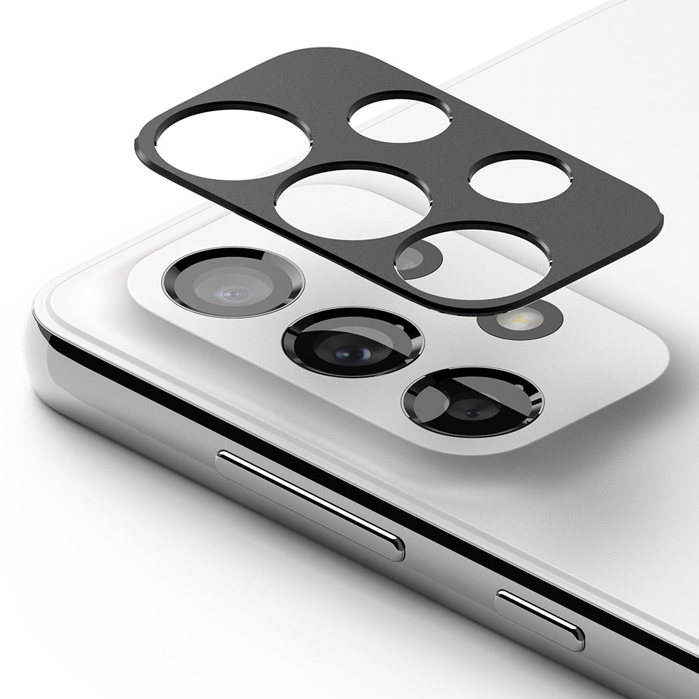Galaxy A33 5G / A53 5G / A73 5G | Camera Styling - Black protective camera lens cover hovering above a white smartphone.