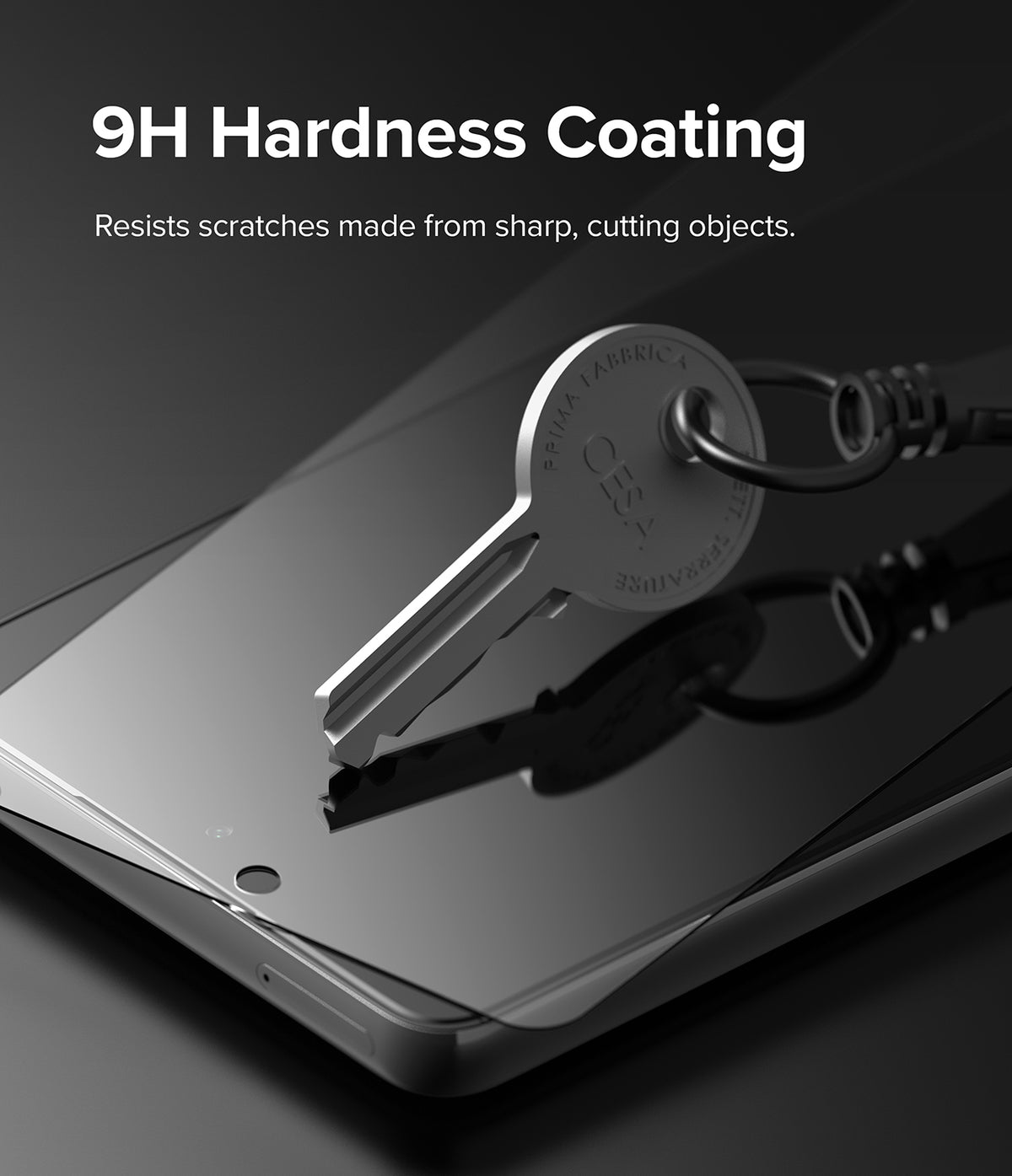 Galaxy A53 5G Screen Protector | Invisible Defender - Galaxy A53 5G Screen Protector - A metal key resting on a screen protector, demonstrating 9H hardness scratch resistance.