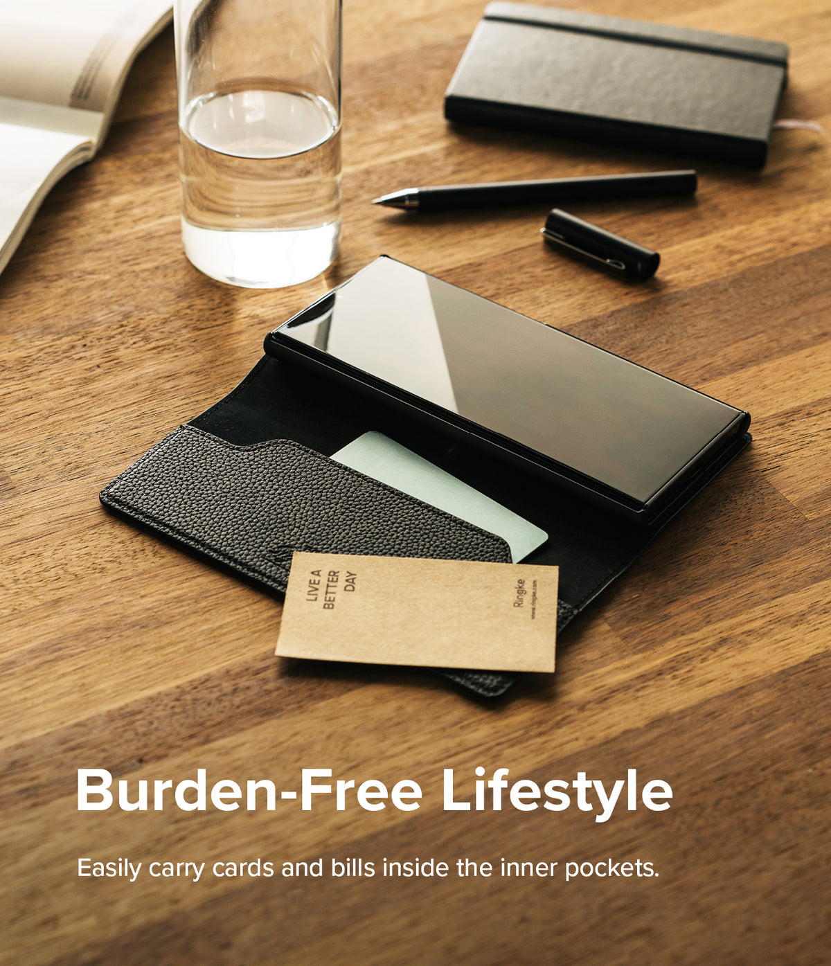Galaxy S22 Ultra Case | Folio Signature EZ Strap - Black leather folio phone case with card slots on a wooden desk.
