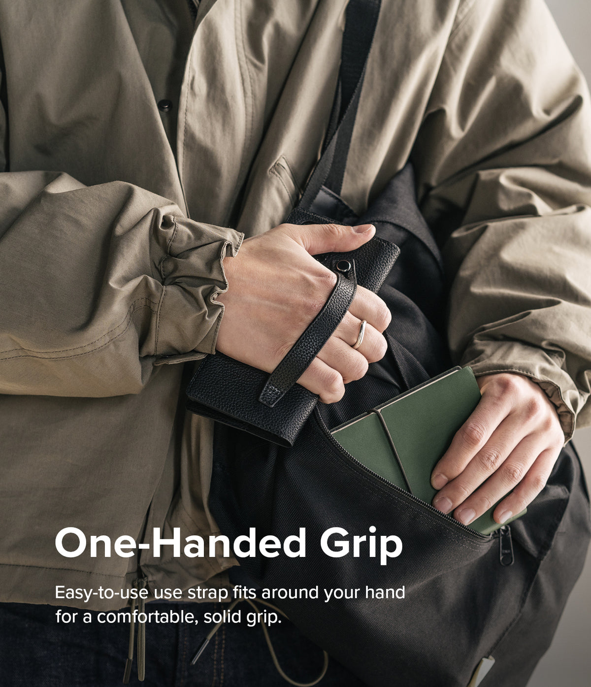 Galaxy S22 Ultra Case | Folio Signature EZ Strap - Hand holding a black leather phone case with an integrated strap.