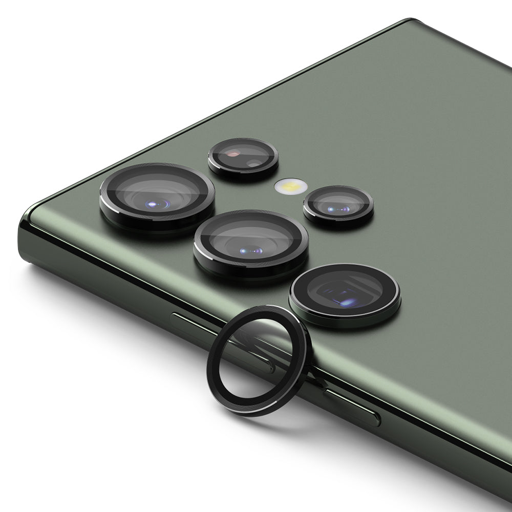 Galaxy S23 Ultra Lens Protector | Camera Lens Frame Glass - Galaxy S23 Ultra Lens Protector - Black circular lens covers installed on a green smartphone camera array.