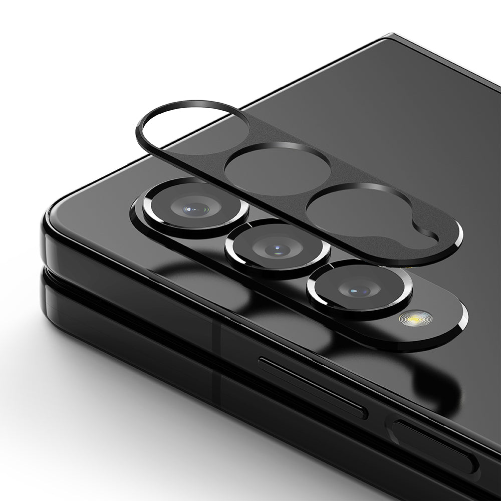 GIFT SET | Galaxy Z Fold 4 - Black camera lens protector hovering above the triple-lens array of a Galaxy Z Fold 4.